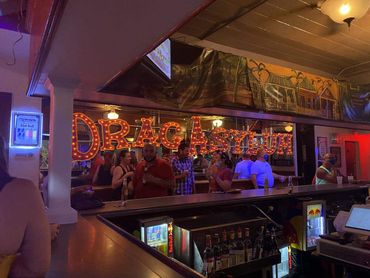 Customers showed up at 12:01 a.m. June 5, 2020, for the reopening of 801 Bourbon Bar on Duval Street.