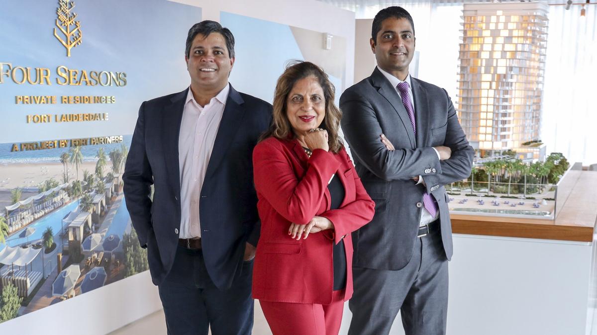 Ramola Motwani, chairwoman and CEO of Merrimac Ventures, is photographed with her two sons Dev, left, and Nitin Motwani inside the sales center of their current development, the Four Seasons Fort Lauderdale Beach on Wednesday, December 18, 2019.