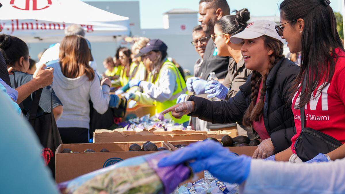 Members of the Junior League of Miami distribute fresh food in a partnership with Food Rescue South Florida.