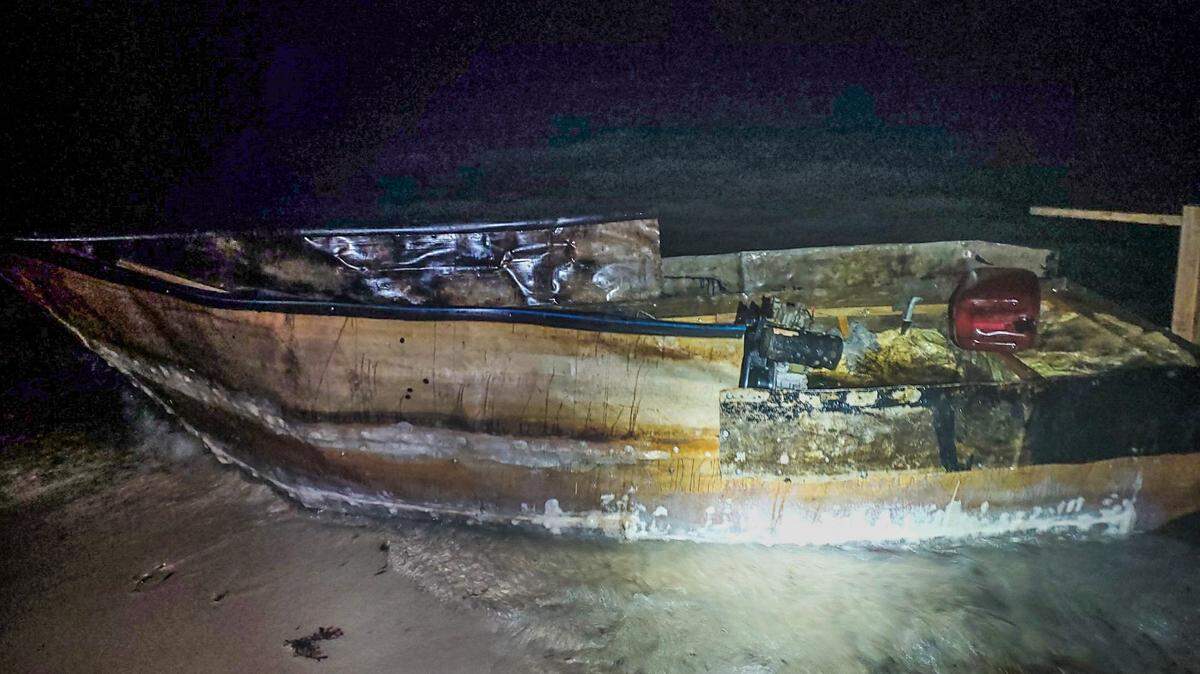 A migrant boat rests on the shores of a Florida Keys island Thursday night, April 14, 2022. Two Cuban migrants were on the vessel, according to the U.S. Border Patrol.