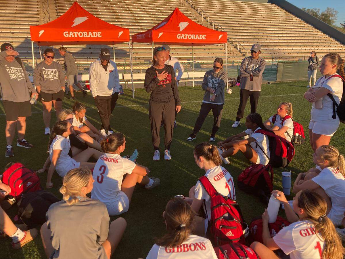 Cardinal Gibbons’ coach Margo Flack speaks to her team after the Chiefs’ 4-0 loss to Orlando Lake Highland Prep in a Class 3A state semifinal on Tuesday at Spec Martin Stadium in DeLand, Fla.