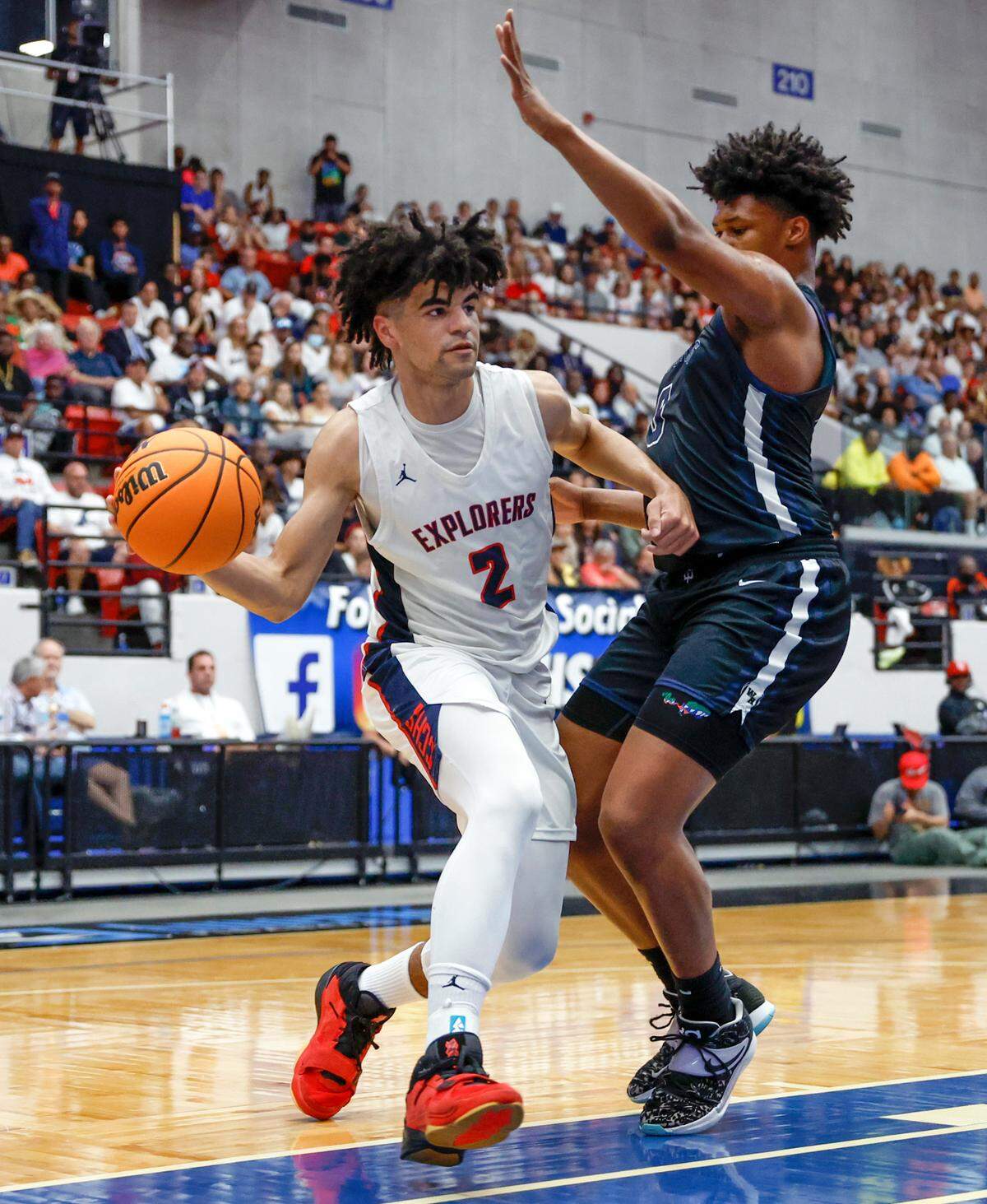 Columbus High School’s Cayden Boozer (2) looks to pass as Winter Havens Jamie Phillips, Jr. (0) defends during the FHSAA boys basketball Class 7A State Championship at the RP Funding Center in Lakeland, Florida on Saturday, March 4, 2023.