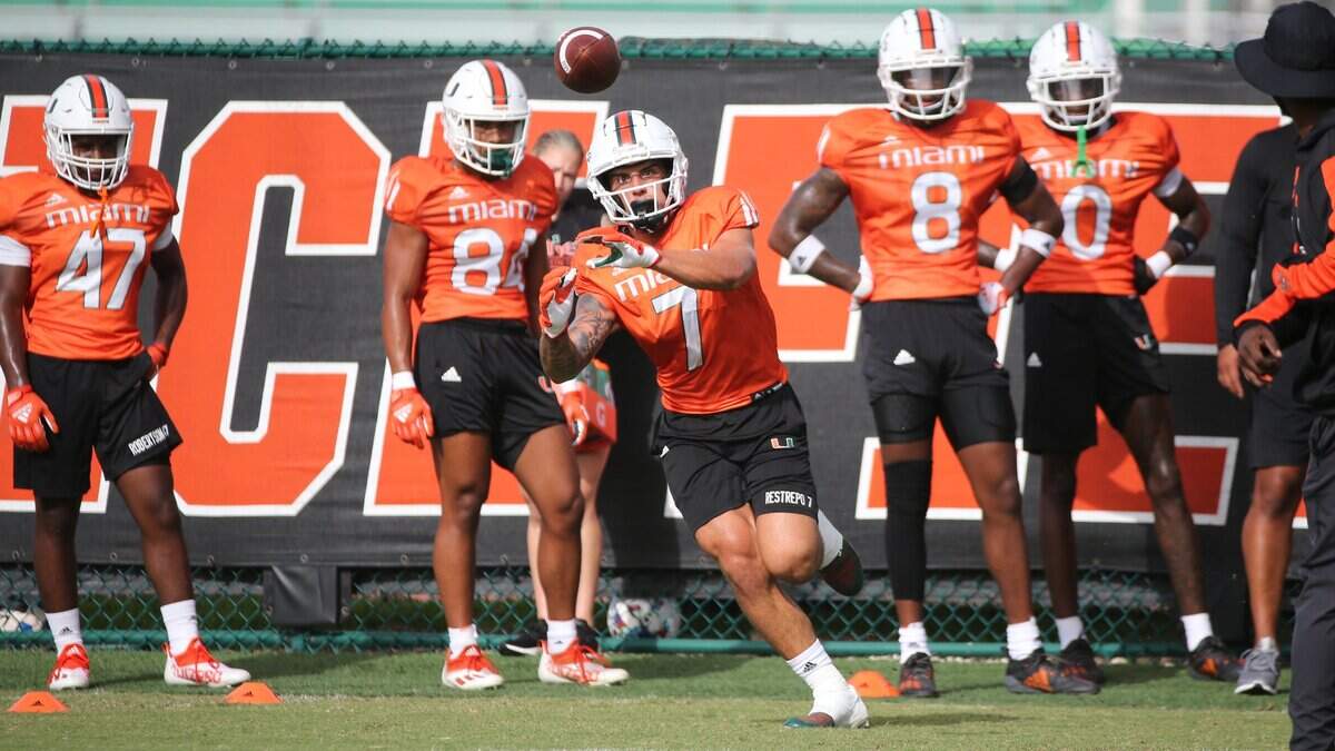 Miami Hurricanes wide receiver Xavier Restrepo (7) catches the ball during practice drills at Greentree Practice Field at the University of Miami in Coral Gables on Tuesday, August 9, 2022.