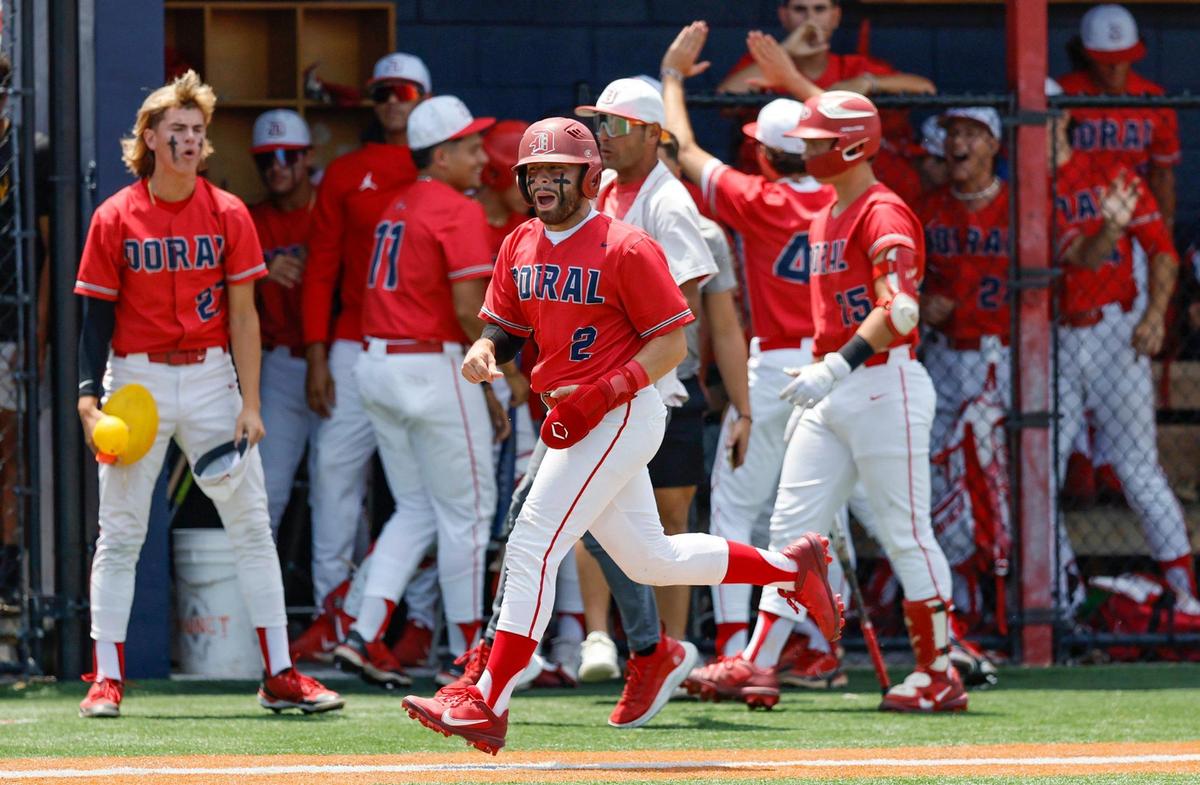 Doral Firebirds (2) Justin Ruiz runs to home plate to score in the third inning against the Varela Varsity Vipers at Doral Academy in Doral on Saturday, May 13, 2023.