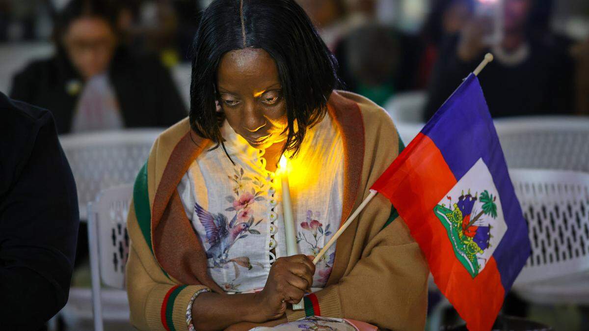 Linda Joseph, a community activist, silently prays during a TPS candlelight vigil as public officials from Miami-Dade County, the City of Miami and North Miami, along with community members, gathered for a prayer vigil at the Little Haiti Cultural Complex on Feb. 3, 2026, in Miami.