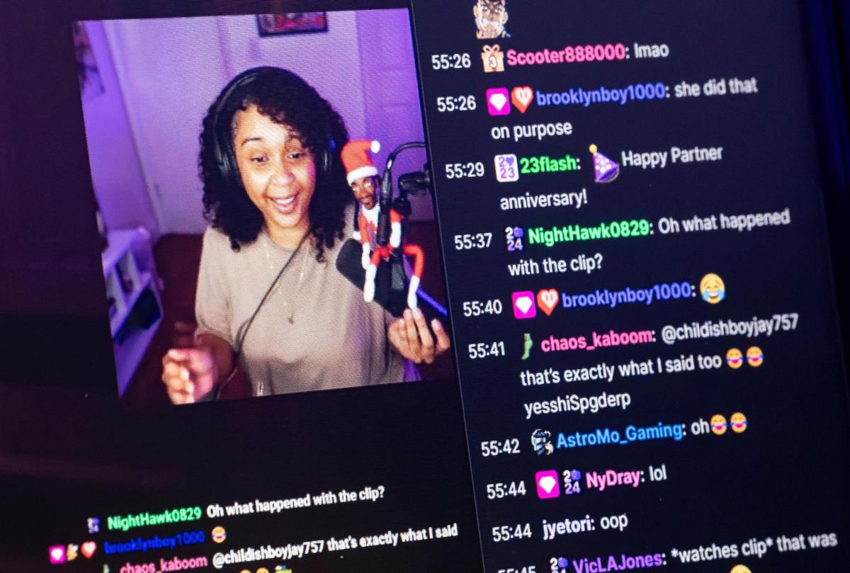 Natasha Walsh, a Twitch streamer and social media influencer, watches a previously recorded video of herself at her home on Thursday, April 3, 2025, in Miami. Walsh, whose Twitch handle is BarefootTasha, streams for about five to six hours a day, five times a week, and has almost 40,000 followers on Twitch.