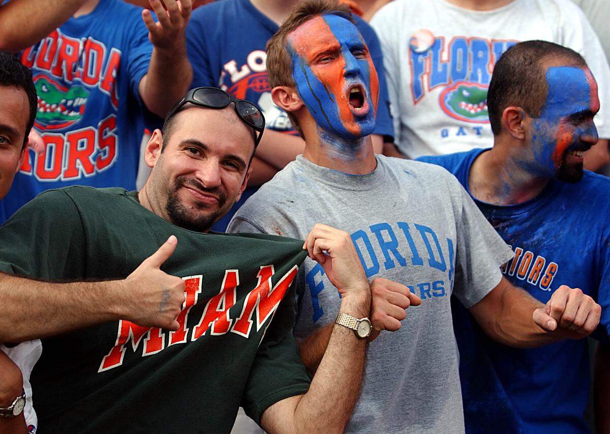 Miami Hurricanes and Florida Gators fans root for their team on Sept. 7, 2002.