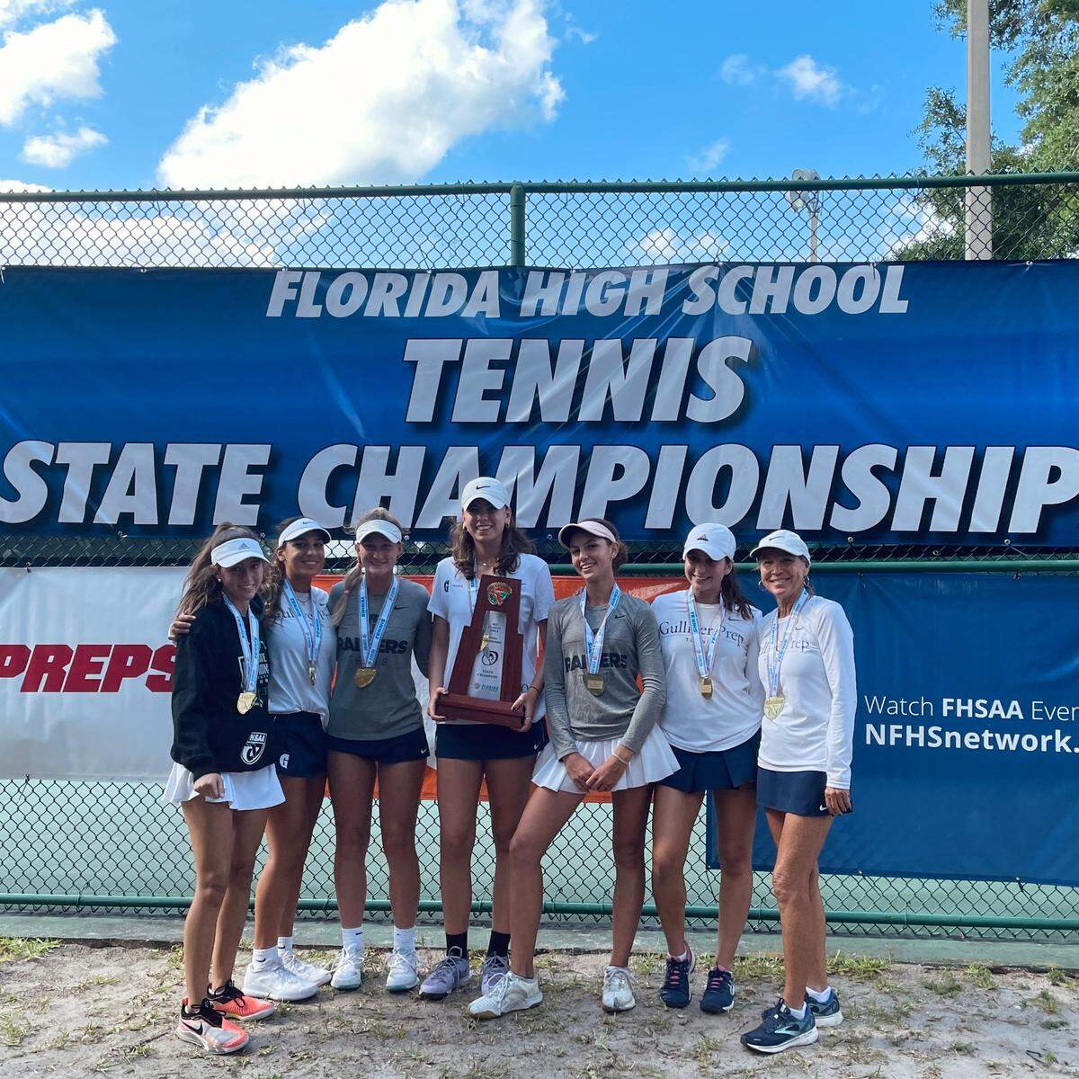 Gulliver’s girls’ tennis team celebreates its state championship in Class 2A on Thursday in Altamonte Springs.