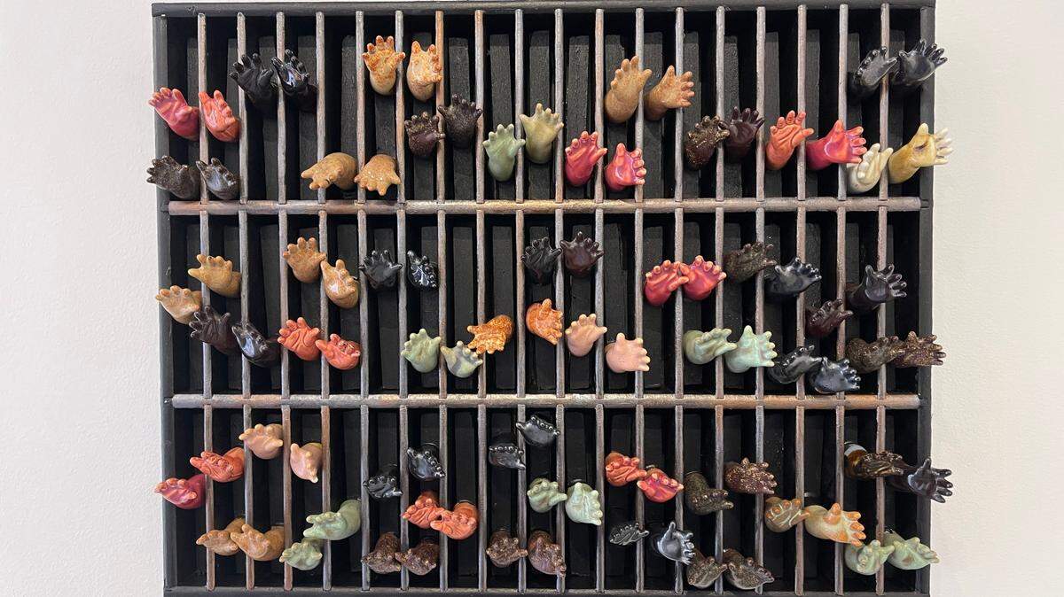Caroline Holder’s “Land of the Free?” (2019) features ceramics, found objects and collage.