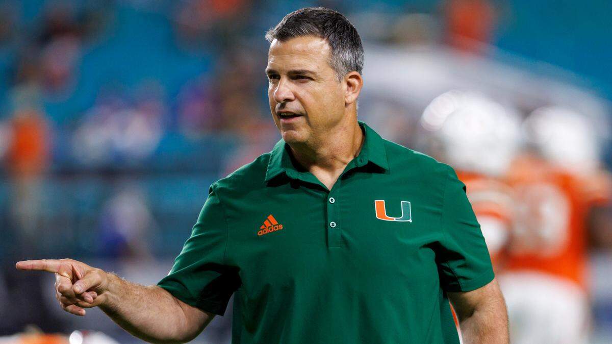 Miami Hurricanes head coach Mario Cristobal give instructions to his team during pregame warmups before the start of an ACC conference football game against the Pittsburgh Panthers at Hard Rock Stadium on Saturday, November 26, 2022 in Miami Gardens, Florida.