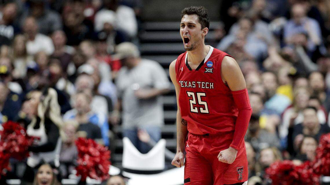 Texas Tech guard Davide Moretti celebrates after scoring against Michigan during the second half an NCAA men’s college basketball tournament West Region semifinal Thursday, March 28, 2019, in Anaheim, Calif.