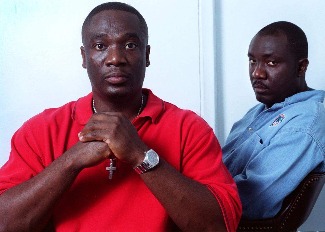 Friday 05/25/01 - Richard Patterson/for the Herald - for 1A - from Left: Sidney and Nathaniel Ferguson, whose sister, Dorothy Gibson, was murdered in 1977, sit together in Miami on Friday. Jerry Frank Townsend pleaded to the crime (and others), but police now say he is likely innocent. The Ferguson brothers, however, are not ready or willing to accept that notion.