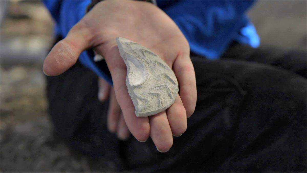 The pottery fragment from a “magical mirror.”