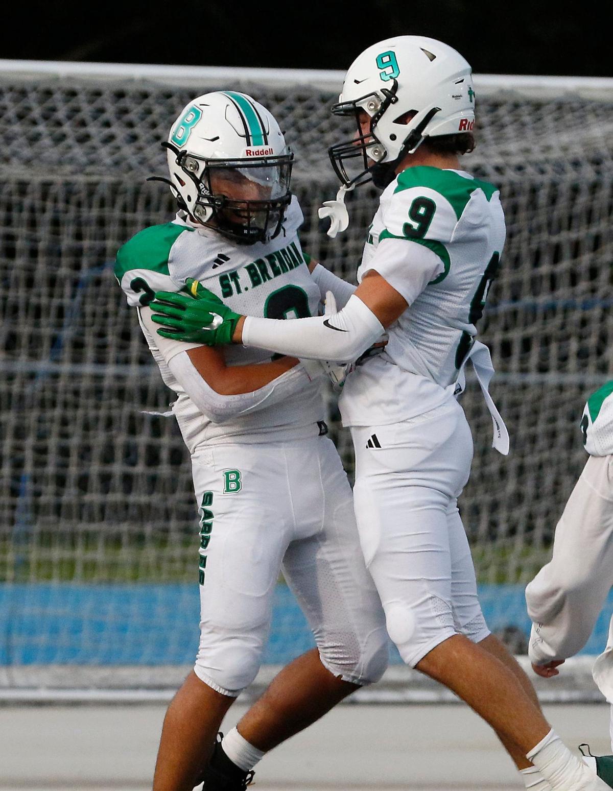St. Brendan Sabres running back Geovanni Tobon (2, on the left) celebrates a touchdown against Archbishop McCarthy Mavericks during football game on Thursday, September 5, 2024 at Archbishop McCarthy HS in Southwest Ranches. Andrew Uloza / for Miami Herald