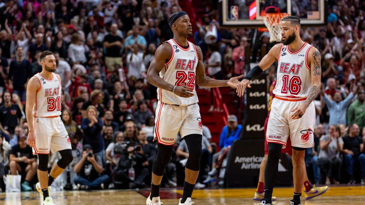 Miami Heat forward Jimmy Butler (22) reacts with teammate Caleb Martin (16) after scoring during the second half of an NBA game against the Cavs at Miami-Dade Arena in Downtown Miami, Florida, on Friday, March 10, 2023.
