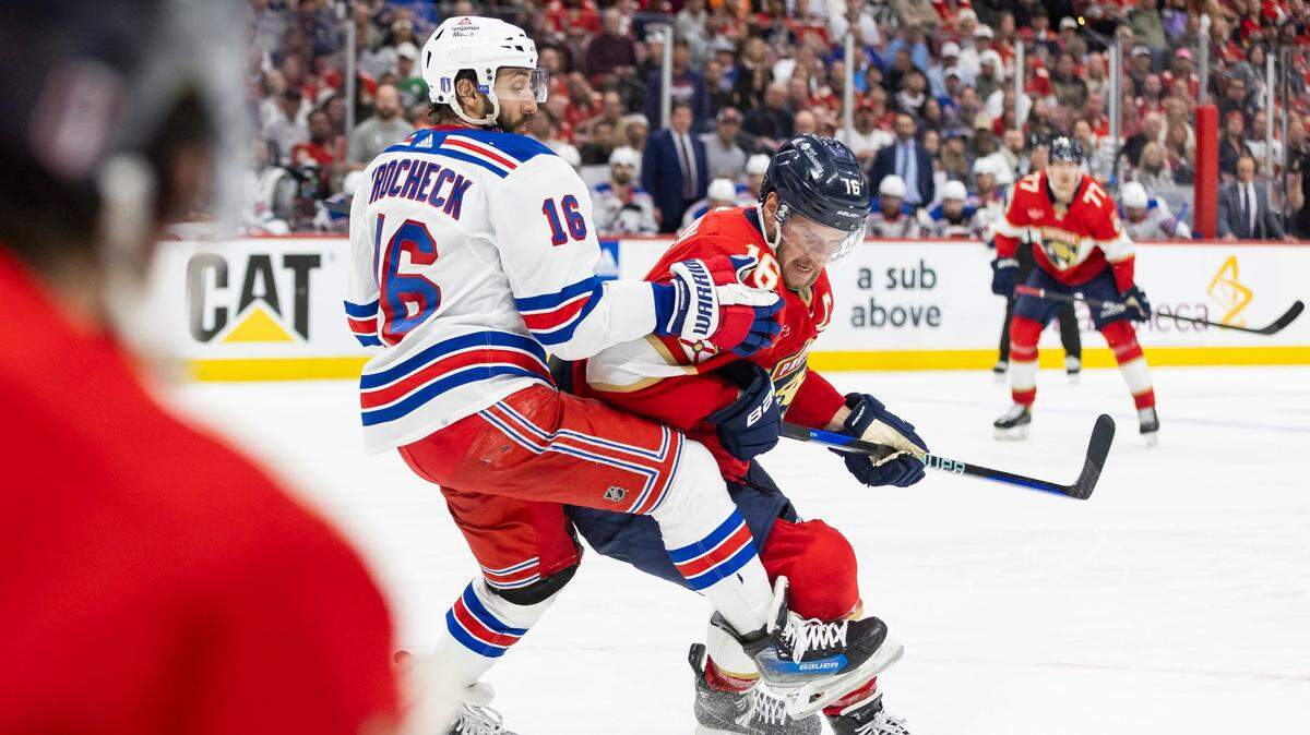 Florida Panthers center Aleksander Barkov (16) and New York Rangers center Vincent Trocheck (16) compete for the puck in the third period of Game 4 during the Eastern Conference finals of the NHL hockey Stanley Cup playoffs at the Amerant Bank Arena on Tuesday, May 28, 2024, in Sunrise, Fla.