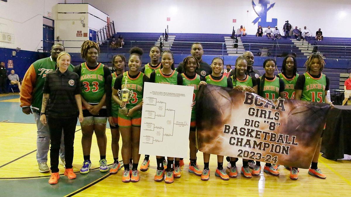 Blanche Ely Lady Tigers pose with the trophy after winning BCAA Big 8 basketball girls final game against St. Thomas Aquinas Lady Raiders on Saturday, January 27, 2024 at Fort Lauderdale HS in Fort Lauderdale. Andrew Uloza / for Miami Herald