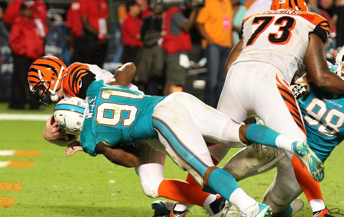 Miami Dolphins Cameron Wake sacked for safety Cincinnati Bengals quarterback Andy Dalton in the fourth quarter during the game Miami Dolphins vs Cincinnati Bengals at Sun Life Stadium in Miami on Thursday, October 31, 2013.
