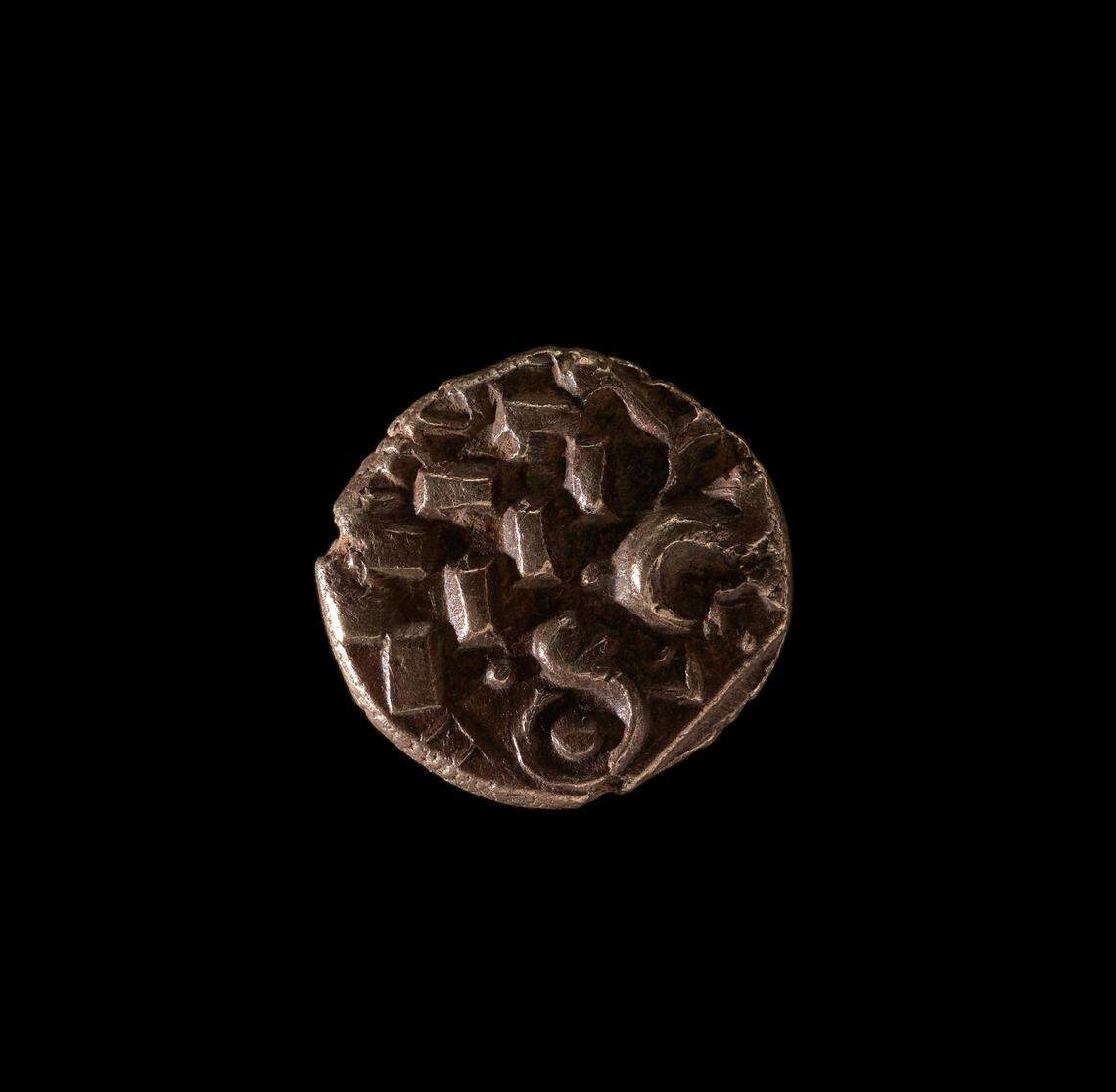 A close-up photo of the back side of one of the Iron Age gold coins found in Anglesey.