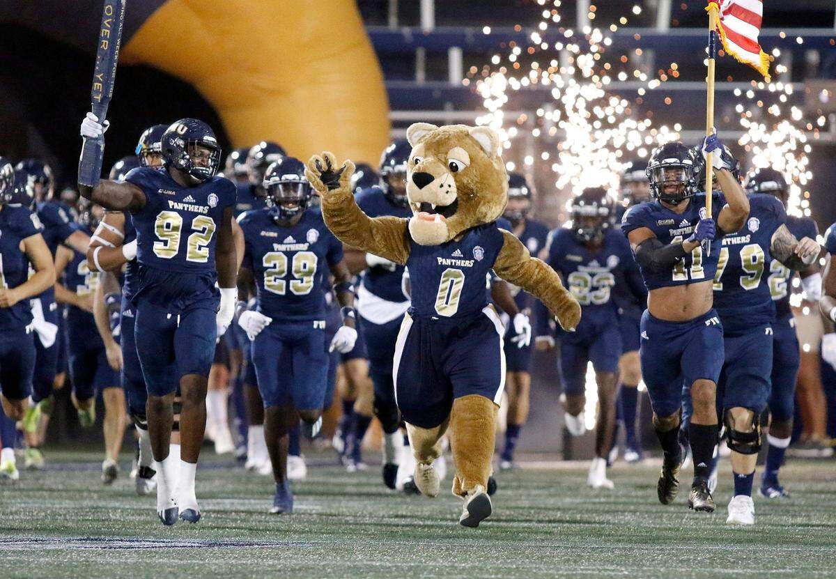 FIU Panthers lead by Roary take the field for the game against Western Kentucky Hilltoppers Saturday, October 23, 2021 at Riccardo Silva Stadium in Miami