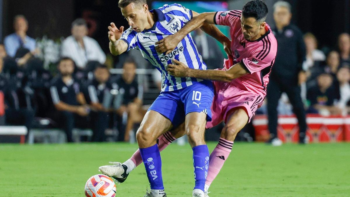 Inter Miami midfielder Sergio Busquets (5) battles Monterrey midfielder Sergio Canales (10) in the first half of their CONCACAF Champions Cup quarterfinal soccer match at Chase Stadium in Fort Lauderdale, Fla., on Wednesday, April 3, 2024.