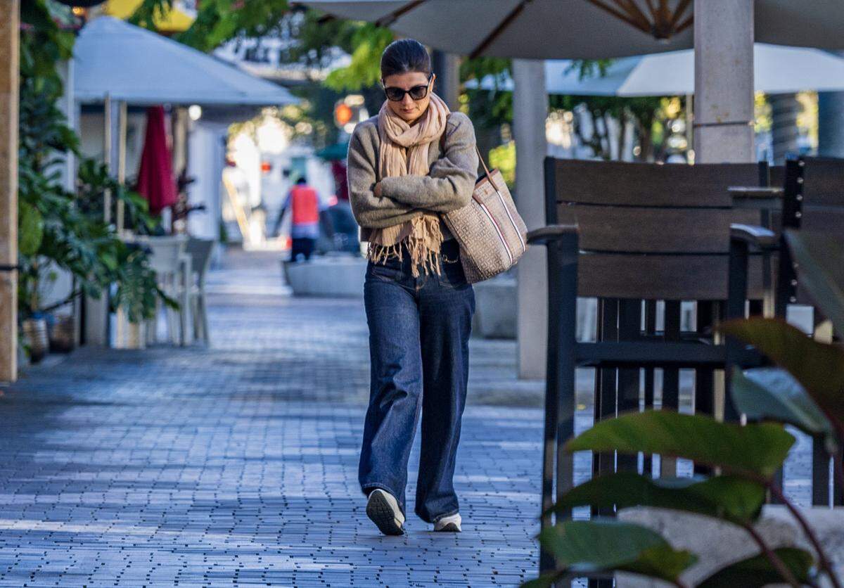The cold temperatures didn't stop Maria Faria, from taking a walk along Miracle Mile in Coral Gables, as Miami woke to one of its coldest New Year's Eves in decades, on Wednesday, December 31, 2025. 