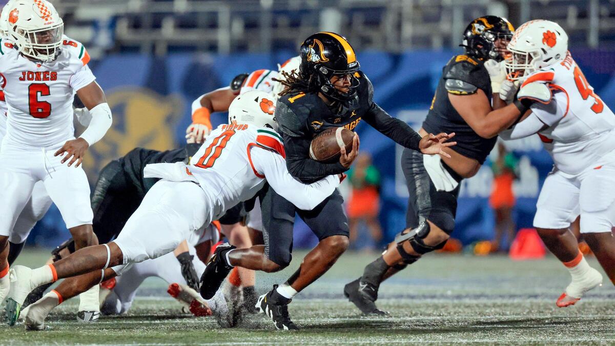 American Heritage’s quarterback Malachi Toney (1) runs the ball on a keeper against Jones High School in the first half during the Florida High School Football State Championships - Class 4A game at Pitbull Stadium on the campus of Florida International University in Miami, Florida, on Friday, December 13, 2024.