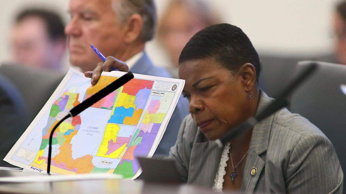 Sen. Audrey Gibson, D-Jacksonville, reviews proposed district maps during a Committee on Reapportionment meeting, Tuesday, April 19, 2022, at the Capitol in Tallahassee, Fla.
