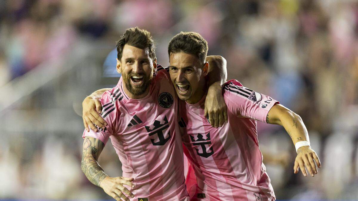 Inter Miami forward Tadeo Allende (21) celebrates with forward Lionel Messi (10) after scoring a goal against Nashville SC in the second half of match one of their MLS Playoffs series at Chase Stadium on Friday, Oct. 24, 2025, in Fort Lauderdale, Fla.