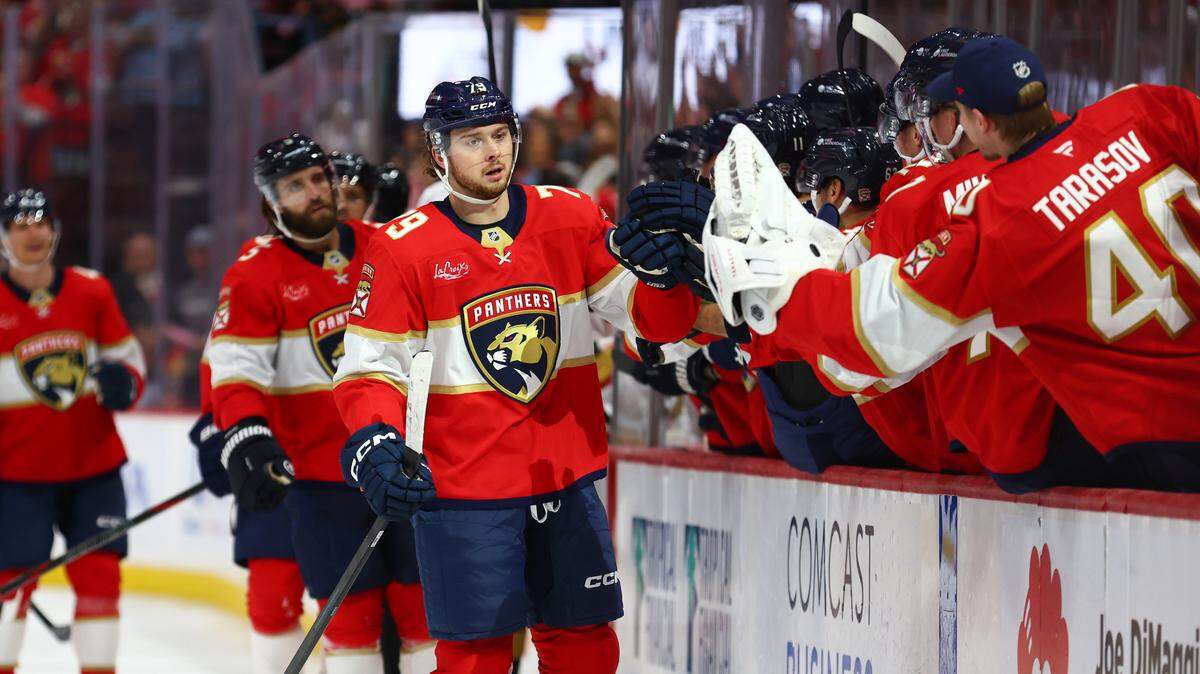 SUNRISE, FLORIDA - OCTOBER 25: Cole Schwindt #79 of the Florida Panthers celebrates with teammates after scoring a goal against the Vegas Golden Knights during the third period of the game at Amerant Bank Arena on October 25, 2025 in Sunrise, Florida. (Photo by Megan Briggs/Getty Images)