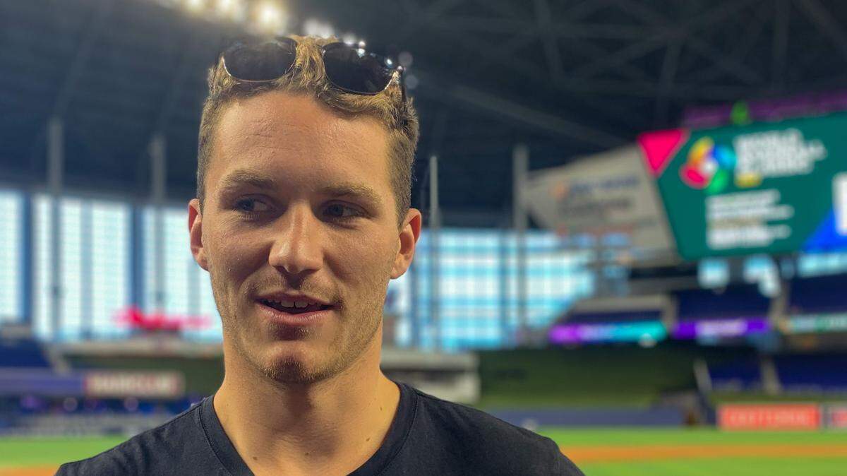 Florida Panthers forward Matthew Tkachuk talks on the field at loanDepot park before throwing out a ceremonial first pitch on Monday, Sept. 12, 2022.