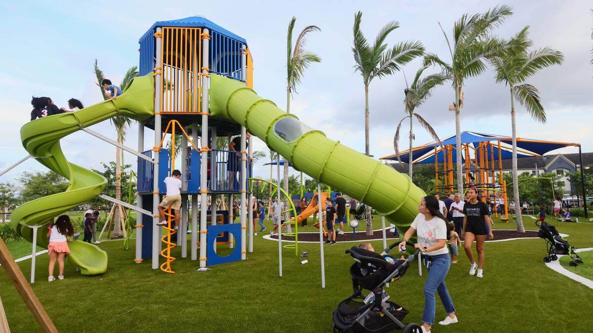 Children enjoy a playground at Doral Central Park on August 26, 2024. Fort Lauderdale has adopted an ordinance that says adults are not permitted in playgrounds unless they are accompanying a child.