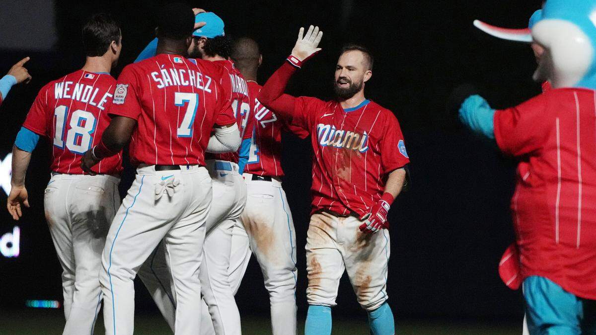 Jun 24, 2023; Miami, Florida, USA; Miami Marlins third baseman Jon Berti (5) celebrates a 4-3 victory over the Pittsburgh Pirates at loanDepot Park. Mandatory Credit: Jim Rassol-USA TODAY Sports