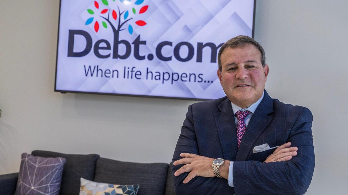 Howard Dvorkin, the founder of Debt.com, poses in his office in Davie, Florida, on Thursday, March 13, 2025.