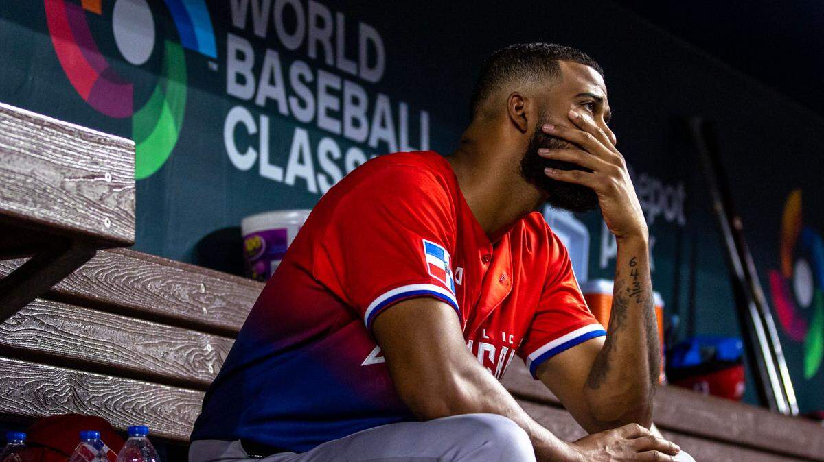 Dominican Republic pitcher Sandy Alcantara (20) reacts in the dugout during the fifth inning of a 2023 World Baseball Classic game at loanDepot Park in Miami, Florida, on Saturday, March 11, 2023. Dominican Republic would go on to lose 5-1 to Venezuela.