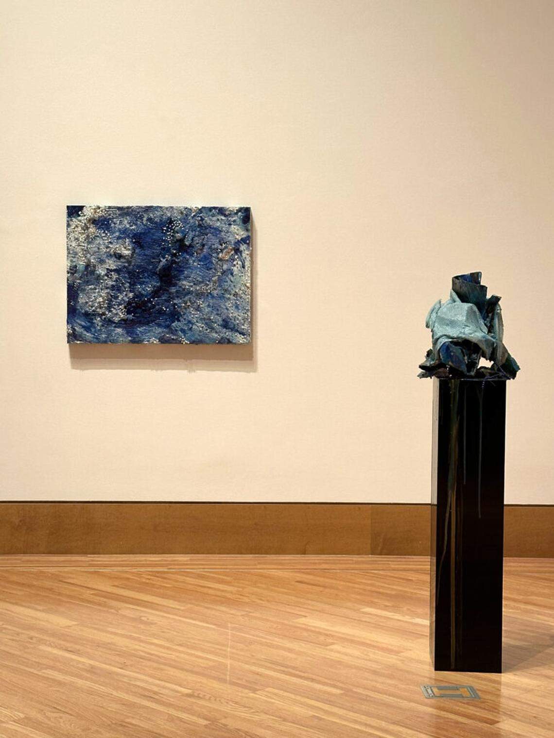 Installation view of Cristina Lei Rodriguez’s painting “Push Back” and sculpture “Decadence Revisited (Turquoise)” in exhibition “Of What Surrounds Me” at FIU Frost Art Museum.