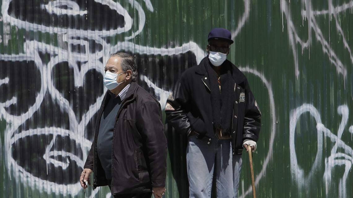 Pedestrians wear protective masks during the coronavirus pandemic on Second Avenue Wednesday, May 13, 2020, in New York. (AP Photo/Frank Franklin II)