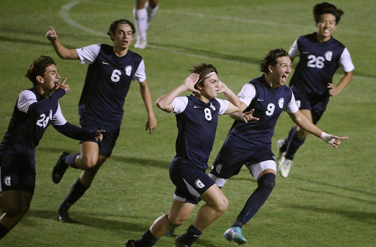 Gulliver Prep players celebrate during the FHSAA Class 4A state championship game of Bishop Moore Catholic High versus Gulliver Prep at Spec Martin Stadium in DeLand on Thursday, February 23, 2023. Gulliver Prep won won the match to claim the state championship. (Stephen M. Dowell/Orlando Sentinel)