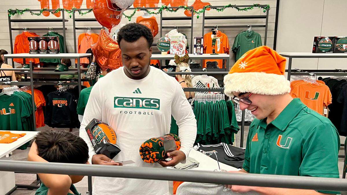 Miami Hurricanes freshman defensive end Rueben Bain, the ACC Defensive Rookie of the Year, took part as a guest shopper to help children in The Hurricanes Team Store Shopping Spree. The event honored the legacy of the late Miami football player Bryan Pata on Monday, Dec. 11, 2023.