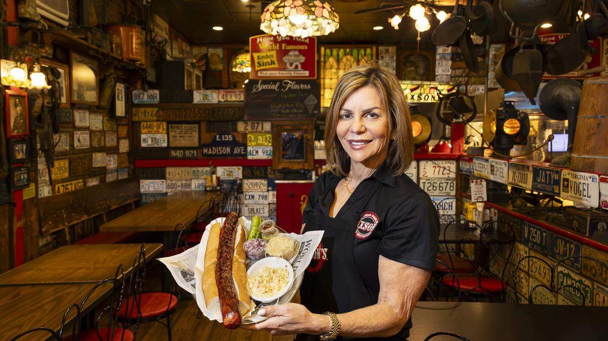 Linda Udell Zakheim, owner of Jaxson's Ice Cream Parlor & Restaurant, holds their 1-pound Artillery Dog inside her establishment on Thursday, Feb. 5, 2026, in Dania Beach, Fla. Jaxson's is celebrating its 70th anniversary this month.