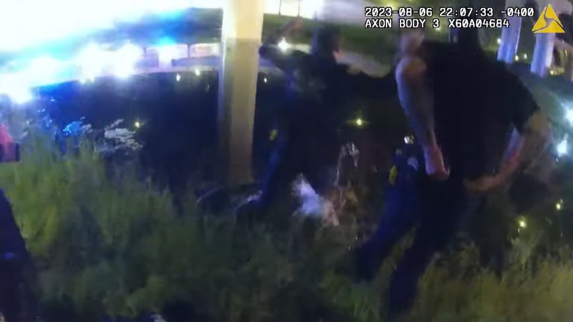Two officers quickly dropped their heavy equipment and jumped into the water, body camera footage showed.