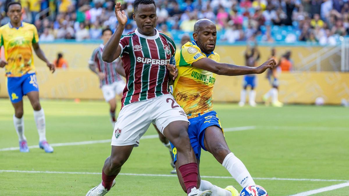 Fluminense FC defender Juan Freytes (22) and Mamelodi Sundowns defender Mosa Lebusa (5) compete for the ball in the second half of their FIFA Club World Cup Group F third-round match at Hard Rock Stadium on Wednesday, June 25, 2025, in Miami Gardens, Fla.