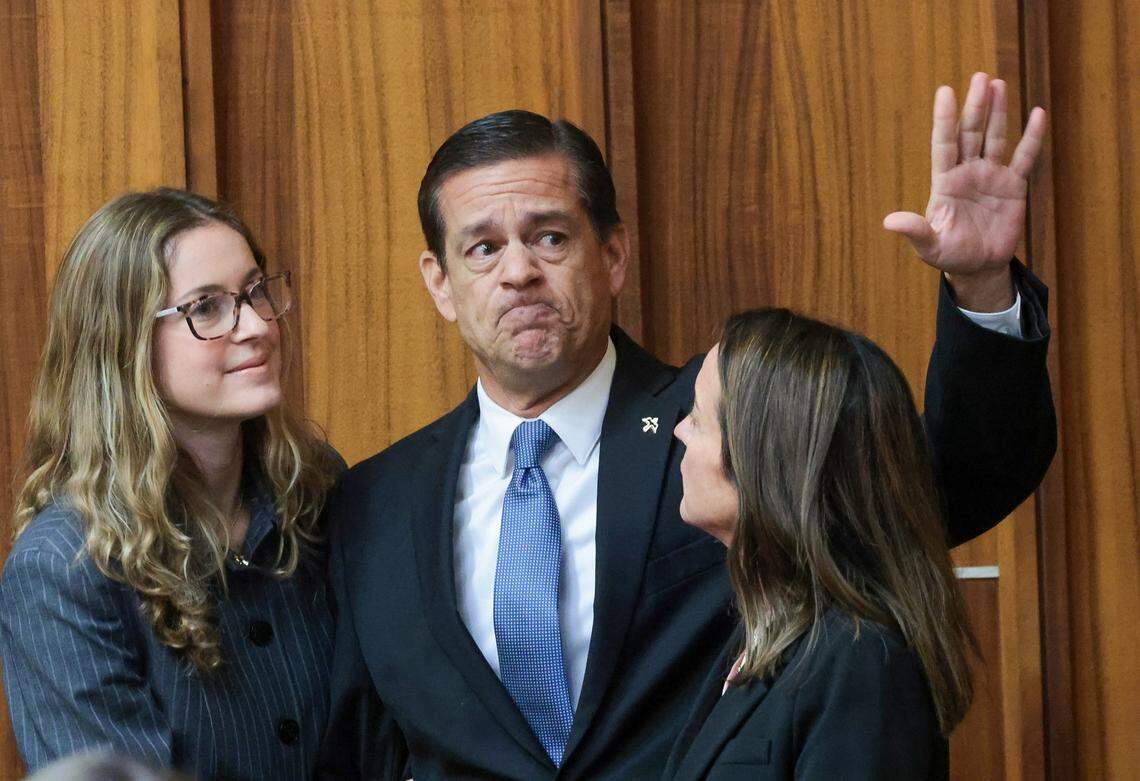 Flanked by his daughter, Carolina Pino, left, and wife, Cecilia Pino, right, real estate broker George Pino acknowledges supporters as they arrive in Courtroom 4-1 for his surrender at the Richard E. Gerstein Justice Building on Thursday, November 21, 2024, in Miami, Florida.