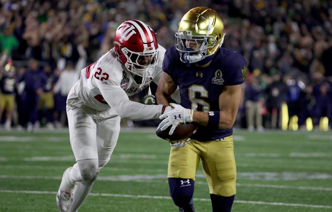 Dec 20, 2024; Notre Dame, Indiana, USA; Notre Dame Fighting Irish wide receiver Jordan Faison (6) makes a catch against Indiana Hoosiers defensive back Jamari Sharpe (22) during the second half at Notre Dame Stadium. Mandatory Credit: Trevor Ruszkowski-Imagn Images