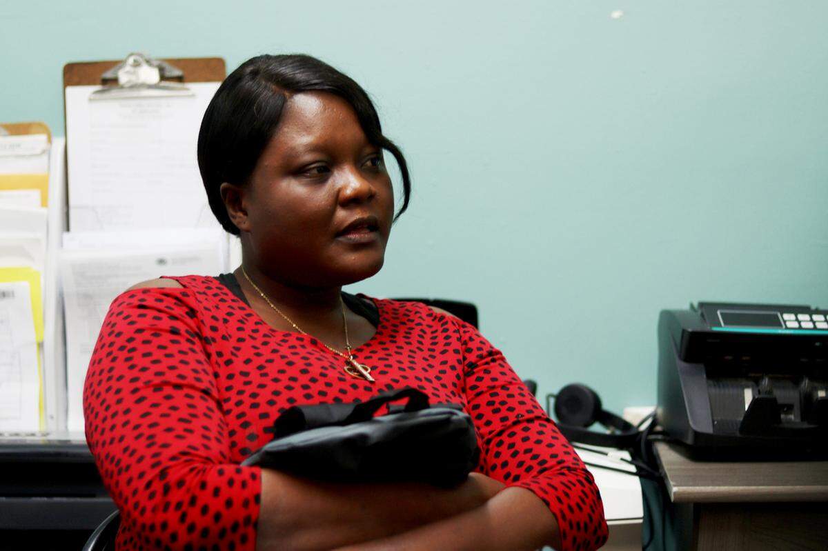 Fabienne Samedi recounts her story while seated at the offices of Three Virtues Organization in Homestead. The agency nominated her for help from Wish Book.