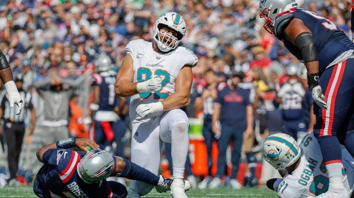 Miami Dolphins defensive tackle Zach Sieler (92) reacts after sacking New England Patriots quarterback Jacoby Brissett (7) in the first half of their NFL football game at Gillette Stadium in Foxborough, Massachusetts on Sunday, October 6, 2024.