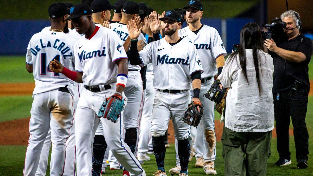 Miami Marlins players react on the field after defeating the Atlanta Braves 12-9 during anMLB game at loanDepot park in the Little Havana neighborhood of Miami, Florida, on Wednesday, October 5, 2022.