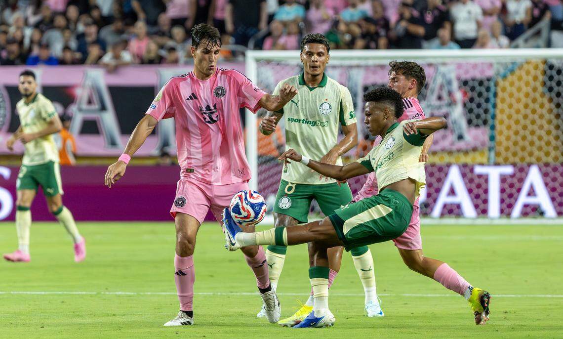 Palmeiras forward Estevao (41) fights for position as Inter Miami midfielder Federico Redondo (55) and defender Noah Allen (32) defend during the first half of their Group A third-round FIFA Club World Cup match at Hard Rock Stadium on Monday, June 23, 2025, in Miami Gardens, Fla.