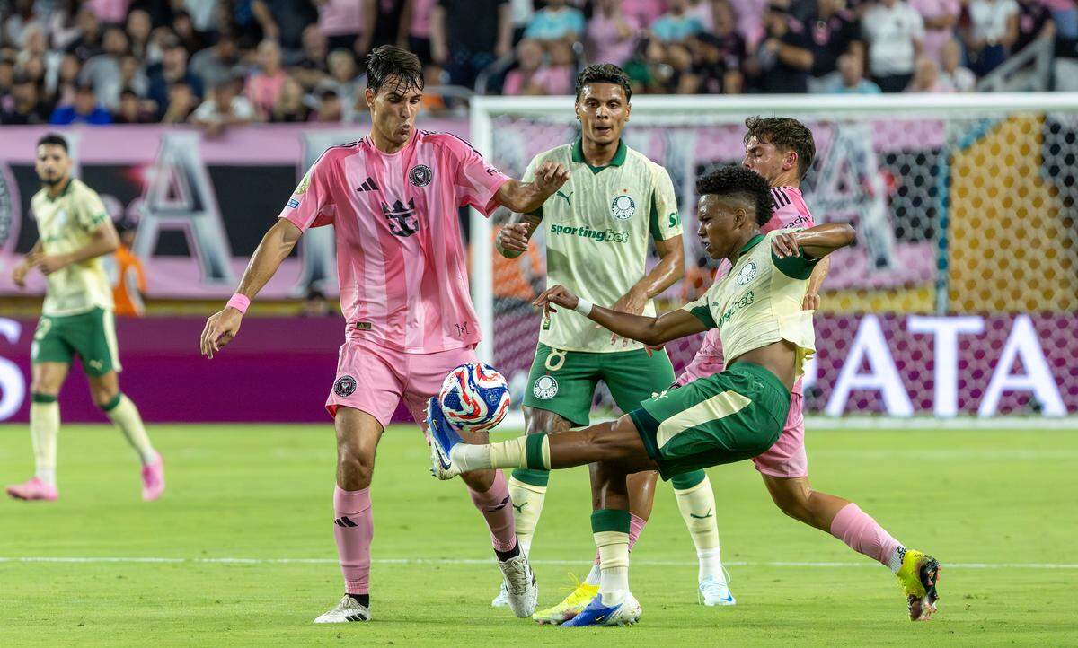Palmeiras forward Estevao (41) fights for position as Inter Miami midfielder Federico Redondo (55) and defender Noah Allen (32) defend during the first half of their Group A third-round FIFA Club World Cup match at Hard Rock Stadium on Monday, June 23, 2025, in Miami Gardens, Fla.