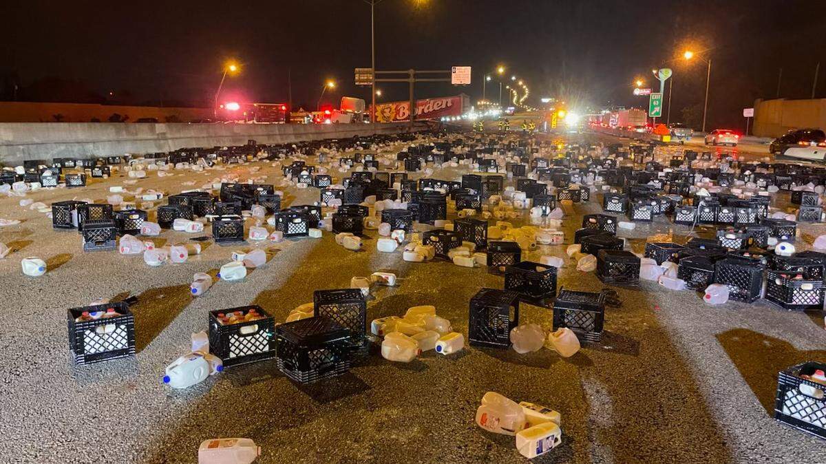 Milk litters the highway on Jan. 29 on Interstate 95 in Palm Beach County.